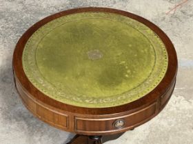 A mahogany 2 drawer drum table with leather top. 51x56cm