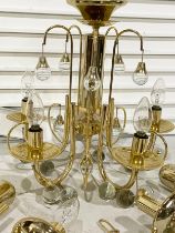 A brass chandelier and a pair of wall light fittings with glass droplets. 42x52cm
