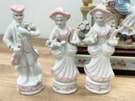A collection of vintage pottery figurines and a figurine mantle clock. Clock measures 22x12x28cm