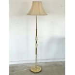 A vintage brass and onyx standard lamp.