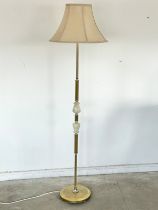 A vintage brass and onyx standard lamp.