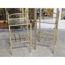 A pair of glass top tables