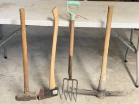 4 garden tools. Sledgehammer, axe, pickaxe and a garden fork.