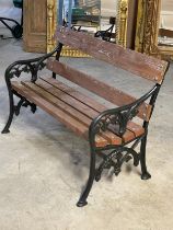 A garden bench with cast iron ends. 123cm