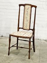 A clean Edwardian high back side chair.