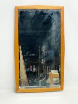 A Mid Century teak framed mirror. 39x67cm