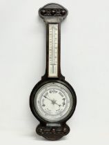 An early 20th century oak barometer. 65cm