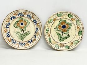 A pair of early 20th century Transylvanian glazed ceramic peasant plates. 24.5cm