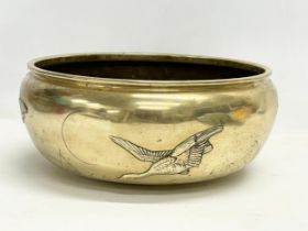 A large late 19th century Japanese heavy brass bowl. 35x15cm