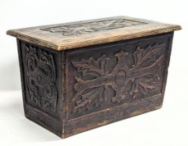 A small vintage carved oak coffer. 65x37x39cm