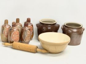 A collection of vintage stoneware. 5 vintage Portuguese Faisco wine bottles. A baking bowl.