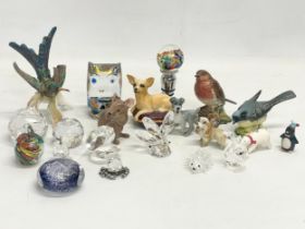 A collection of porcelain and crystal animals. Including a Goebel pottery hummingbird (damage,