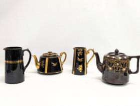 4 pieces of Victorian pottery including 2 Jackfield type 'Jetware' pottery teapot and jug, a Royal