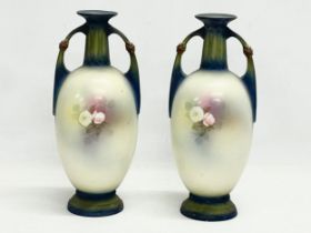 A pair of Austrian hand painted porcelain vases by Robert Hanke for Royal Wettina. Circa 1900. 28cm