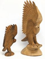 2 large carved wooden eagles. Largest measures 53cm