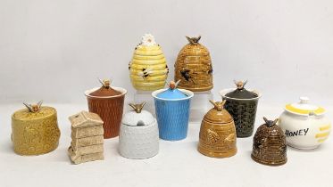 A collection of porcelain honey pots. 14cm