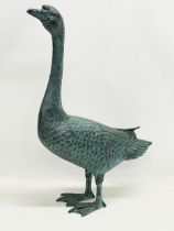 A large cast alloy garden goose figure. 49x72cm