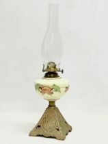 An Edwardian oil lamp with hand painted glass bowl and brass base. 52cm