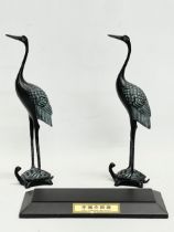 A pair of Chinese bronze cranes on stand. 21x8x27cm