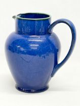 A Denby glazed pottery water jug. 20x20cm