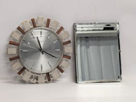 A 1930s Art Deco bevelled mirror with a 1960s Mid Century Sunburst Eurastyle wall clock. Mirror