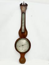 A George IV inlaid mahogany barometer by J. Moretti. Circa 1820. 26x99cm.