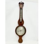 A George IV inlaid mahogany barometer by J. Moretti. Circa 1820. 26x99cm.