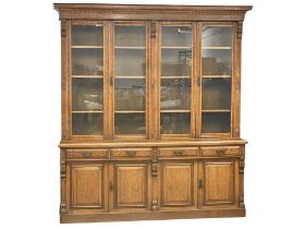 A very large Victorian oak library bookcase with 4 drawers and adjustable shelves. 220x53x246cm