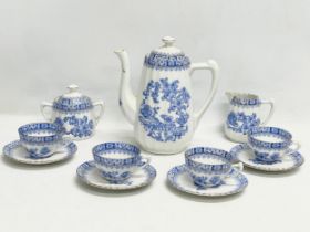 An 11 piece early 20th century fine porcelain ‘China Blau Rosslau’ coffee set by H. Schomberg &