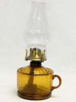 A late Victorian Amber Glass finger oil lamp. 14x28cm