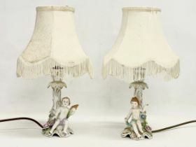A pair of Von Schierholz porcelain cherub lamps. PMP. 36cm