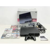 A PlayStation 3 (PS3) in box with controller, leads and games.