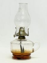 An Edwardian glass finger oil lamp. 15x27cm