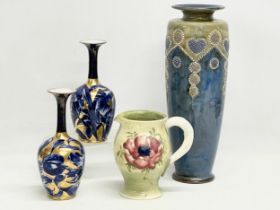 A good collection of pottery. Including a large Royal Doulton Lambeth Art Nouveau style vase 36cm. A