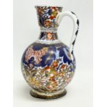 A vintage ‘Imari’ pattern jug. With makers stamp. 15x22cm