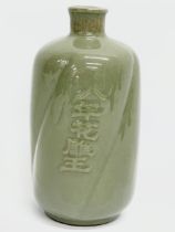 A vintage Chinese Celadon glazed ceramic bottle. 17cm