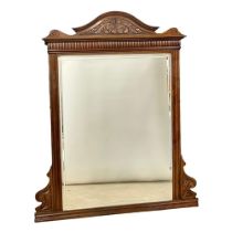 A large late Victorian walnut over-mantle mirror. Circa 1890. 122x144.5cm