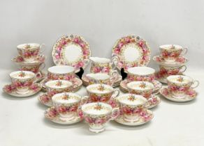 A 39 piece Royal Albert ‘Serena’ tea service. 2 milk jugs. 2 sugar bowls. 12 sandwich plates. 11