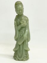 A Chinese jade figure. Early to mid 20th century. 15cm