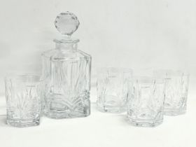 A Galway Crystal drinks set. A decanter and 4 matching whiskey glasses. Decanter measures 24.5cm.