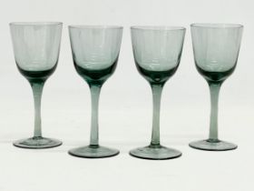 A set of 4 early 20th century wine glasses. 16cm