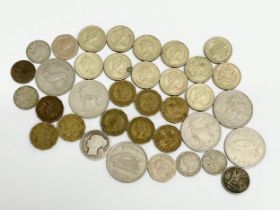 A collection of coins. Silver, £1 coins and others.