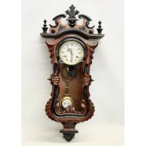 A good quality Victorian style mahogany 31 Day wall clock. With key and pendulum. Orient. 39x88cm