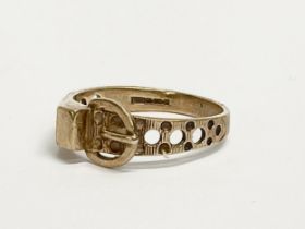 A 9ct gold buckle ring. 1.86g