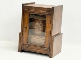 An Edwardian oak humidor smokers pipe cabinet. 21x15.5x28cm