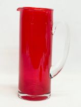 A large Mid Century Swedish style glass pitcher in the manner of Monica Bratt. 27cm