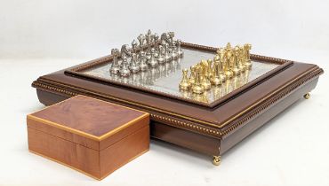 A large ornate chess set with sterling silver board. Board measures 46x46x8cm