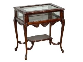A Victorian style carved mahogany display table. 70x47x75.5cm