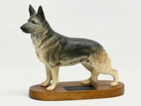 A large Beswick pottery Alsatian German Shepard on stand. 28x22cm