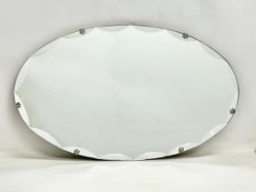 A 1930’s Art Deco bevelled mirror. 68x40cm